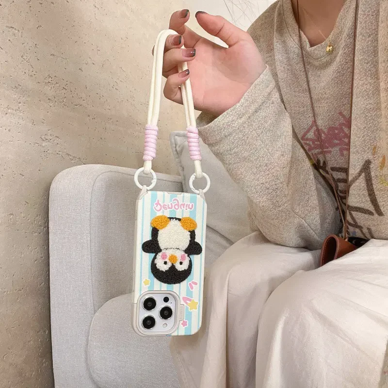 Penguin iPhone 16 case with double-hook wrist strap