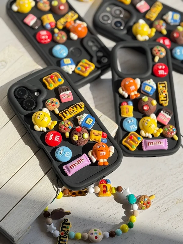 iPhone 16 Pro M&M case featuring a fancy doll