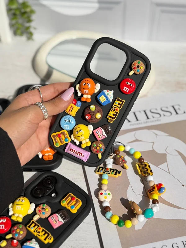 iPhone 16 Pro M&M case featuring a fancy doll