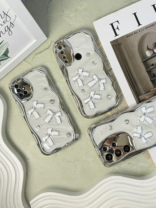 The chrome frame of the prominent shiny bow of the Samsung  A21s phone