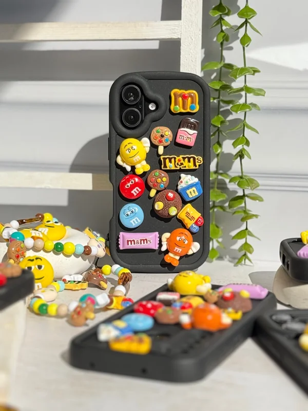 iPhone 16 Pro M&M case featuring a fancy doll
