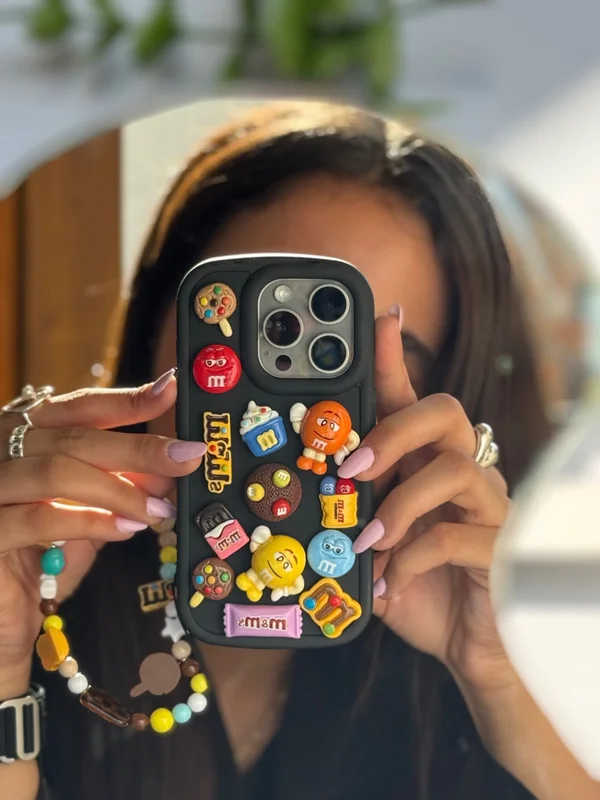 iPhone 16 Pro M&M case featuring a fancy doll