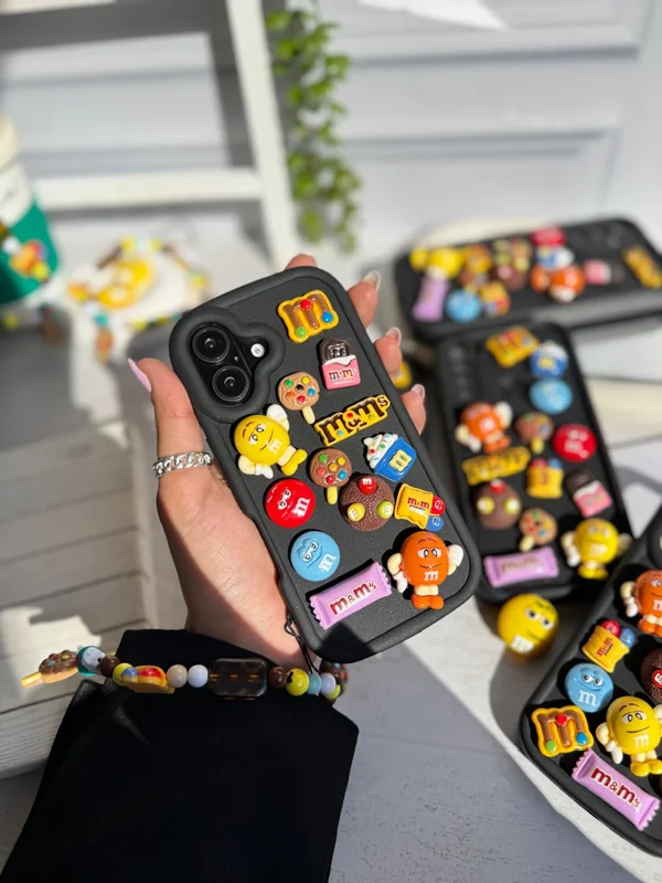 iPhone 16 Pro M&M case featuring a fancy doll